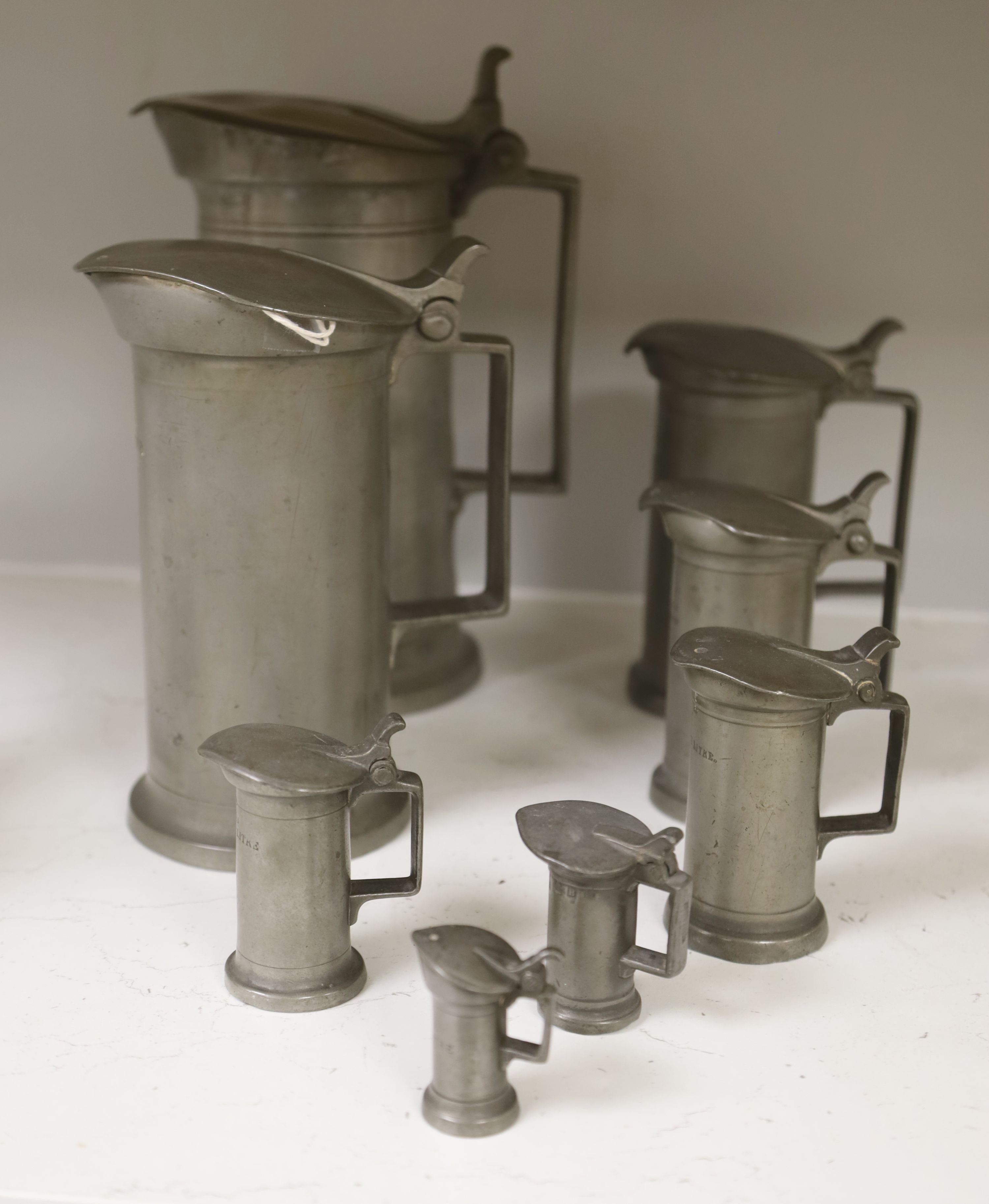 A set of eight graded French pewter measures